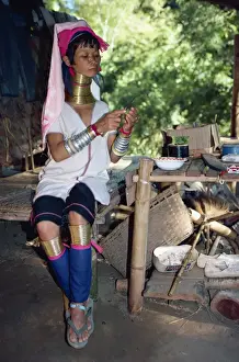 25 30 Years Prints: Long necked woman preparing food on the Thai-Burma border in Thailand