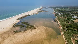 Wetlands Prints: Long sandy beaches surround Cacela Velha in Algarve Portugal with river in view on a clear day