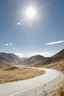 Long winding road through a valley, Otago, South Island, New Zealand, Pacific