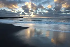 Black Sand Prints: Looking out towards the North Atlantic at sunrise from the black volcanic sand beach at Vik i Myrdal