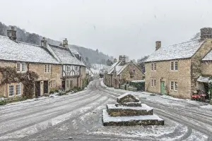 Wiltshire Prints: Looking down the quintessential English village of Castle Combe in the snow, Wiltshire