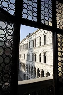 Looking through a window in the Doges Palace, Venice, Veneto, Italy, Europe