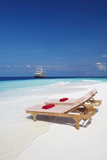 Chairs Prints: Lounge chairs on beach and yacht, Maldives, Indian Ocean, Asia