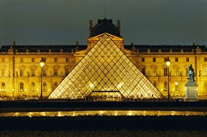 Illumination Prints: The Louvre and pyramid illuminated at night, Paris, France, Europe