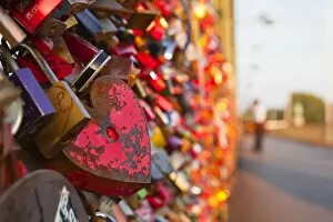 Love locks tied onto the railway bridge in Cologne, North Rhine-Westphalia, Germany, Europe