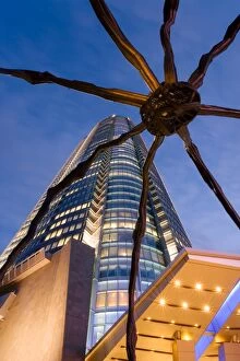 Low angle view at dusk of Mori Tower and Maman Spider sculpture, Roppongi Hills, Minato Wad, Tokyo, Honshu, Japan, Asia