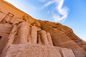 Relics Prints: Low angle view of majestic statues on facade of the Temple of Ramses II
