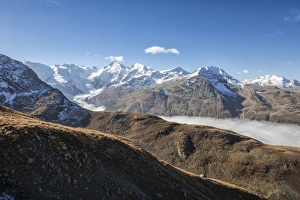 Jagged Prints: Low clouds toward Bernina Group, Languard Valley, Engadine, Canton of Grisons (Graubunden)