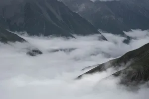 Overcast Prints: Low clouds and mist drift through mountain valleys in Sichuan, China during overcast light
