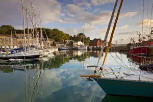 Pad Stow Prints: Low morning light and sailing yacht reflections at Padstow Harbour, Cornwall