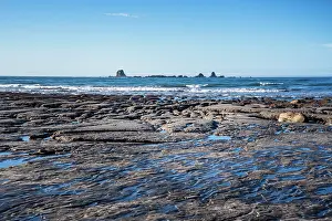 Zealand Prints: Low tide reveals rock shelves along Tasman Sea near Westport, South Island, New Zealand