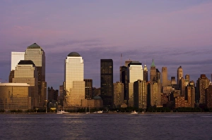 Lower Manhattan skyline across the Hudson River at dusk