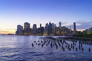 East River Prints: Lower Manhattan skyscrapers including One World Trade Center at sunset from across the East River