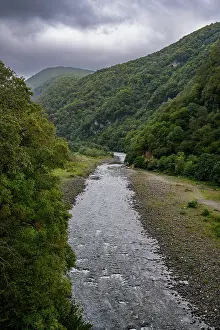 Ecology Prints: Lupshara River flows through green hills in Ritsa Relict National Park in Abkhazia