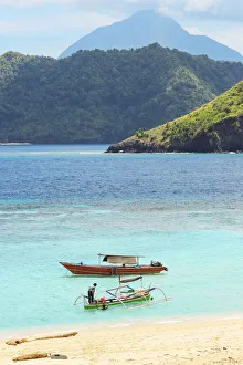 Pants Prints: Mahoro Island beach with tour boats and a volcano far beyond on Siau