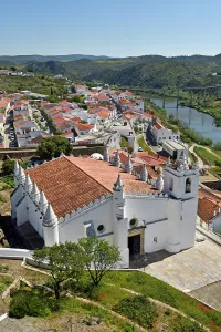 Spires Prints: Main Church of Mertola overlooking Guadiana River in Alentejo region, Portugal