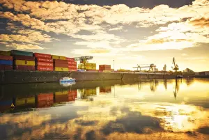 Crane Prints: One of Main Rivers side channels with stacked containers and golden reflections
