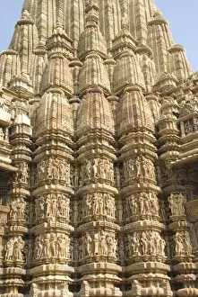 Figures Prints: Detail of the main spire with some of the 646 erotic figures carved in sandstone on the Kandariya Mahadeva Temple