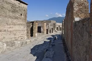 Images Dated 29th July 2010: One of the main streets in the ruins of the Roman site of Pompeii, UNESCO World Heritage Site