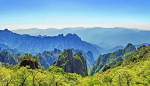 Distances Prints: Majestic mountain view from Huangshan showcasing layered peaks and lush greenery in Anhui Province