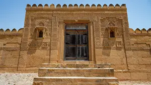 Sacred Prints: Makli Necropolis in Thatta features ancient stone architecture with intricate carvings and a grand entrance