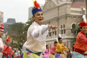 Malay female dancer wearing traditional dress at celebrations