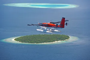 Tropics Prints: Maldivian Air Taxi flying above island, Maldives, Indian Ocean, Asia