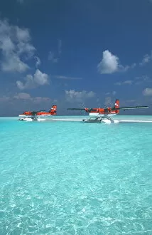 Images Dated 15th March 2010: Maldivian air taxi seaplanes parked on sandbank, Maldives, Indian Ocean, Asia
