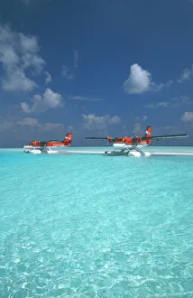 Maldivian air taxi seaplanes parked on sandbank, Maldives, Indian Ocean, Asia