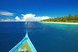 Dhoni Prints: Maldivian fishing boat (dhoni) and tropical island, Maldives, Indian Ocean, Asia