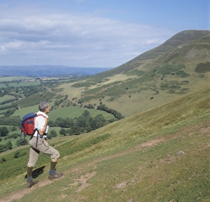 Images Dated 12th February 2008: Man ascending Y Grib with Mynydd Bychan in the background, The Black Mountains
