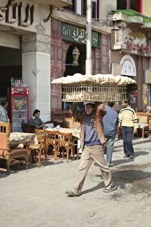 Man carrying bread, Alazhar Square, Cairo, Egypt, North Africa, Africa