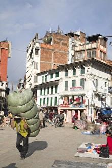 Carrying On Back Prints: Man carrying heavy load through the street, Hanuman Dhoka, Durbar Square