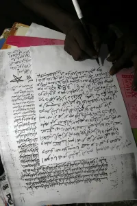 Writing Prints: Man copying the Koran, Mbour, Thies, Senegal, West Africa, Africa