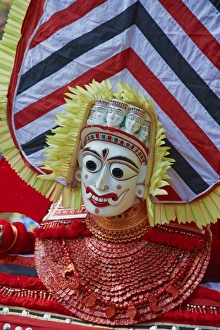 Monster Prints: Man in costume representing a god at the Teyyam ceremony, near Kannur, Kerala, India, Asia