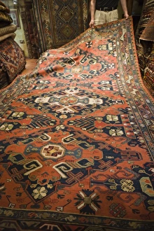 Images Dated 27th May 2008: Man displaying traditional rug for sale, Grand Bazaar (Great Bazaar), Istanbul