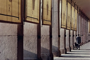 Plaza Mayor Prints: Man and his dog, colonnade, Plaza Mayor, Madrid, Spain, Europe
