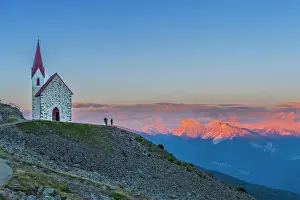 Mid Adults Prints: Man enjoys sunset over Dolomites at the pilgrimage church of Lazfons