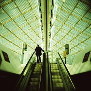 Scaling Prints: Man on escalator, Charles de Gaulle Airport, Paris, France, Europe