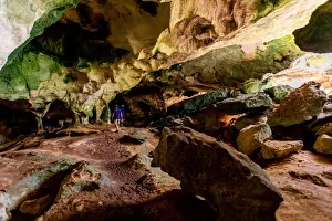 2 People Prints: Man exploring sea caves on North Caicos, Turks and Caicos Islands, Atlantic