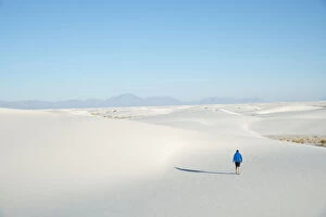 35 39 Years Gallery: A man exploring the vast landscape of White Sands National Park, New Mexico