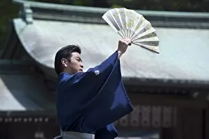 Images Dated 2nd May 2009: Man with fan performing classical Japanese dance called hobu at Meiji Jingu shrine