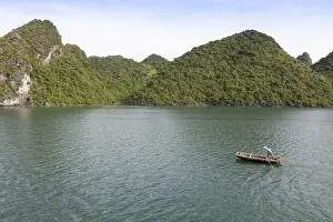 Ha Long Bay Prints: A man in a fishing boat, Ha Long Bay