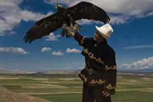 One Bird Collection: Man with his goshawk, Kyrgyzstan, Central Asia, Asia