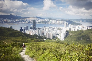 Walker Prints: Man hiking on trail through hills behind Quarry Bay, Hong Kong, China, Asia