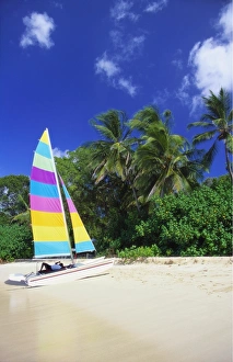 Sailing Boat Prints: Man Lying on His Sailing Boat at St James Beach, Barbados, Caribbean