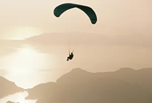 Images Dated 29th August 2008: Man paragliding over the Mediterranean coast