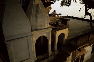 Melody Prints: Man playing sarod on terrace