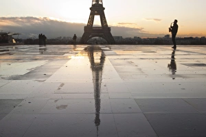 Musical Instrument Prints: A man playing a saxophone in front of the Eiffel Tower, Paris, France, Europe
