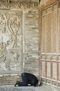 Xian Prints: Man praying at The Great Mosque located in the Muslim Quarter
